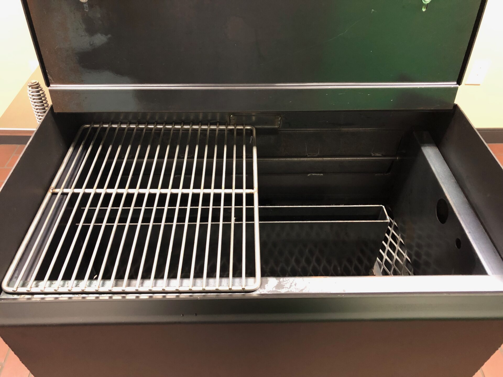 Fire box on the side of the Pit Boss