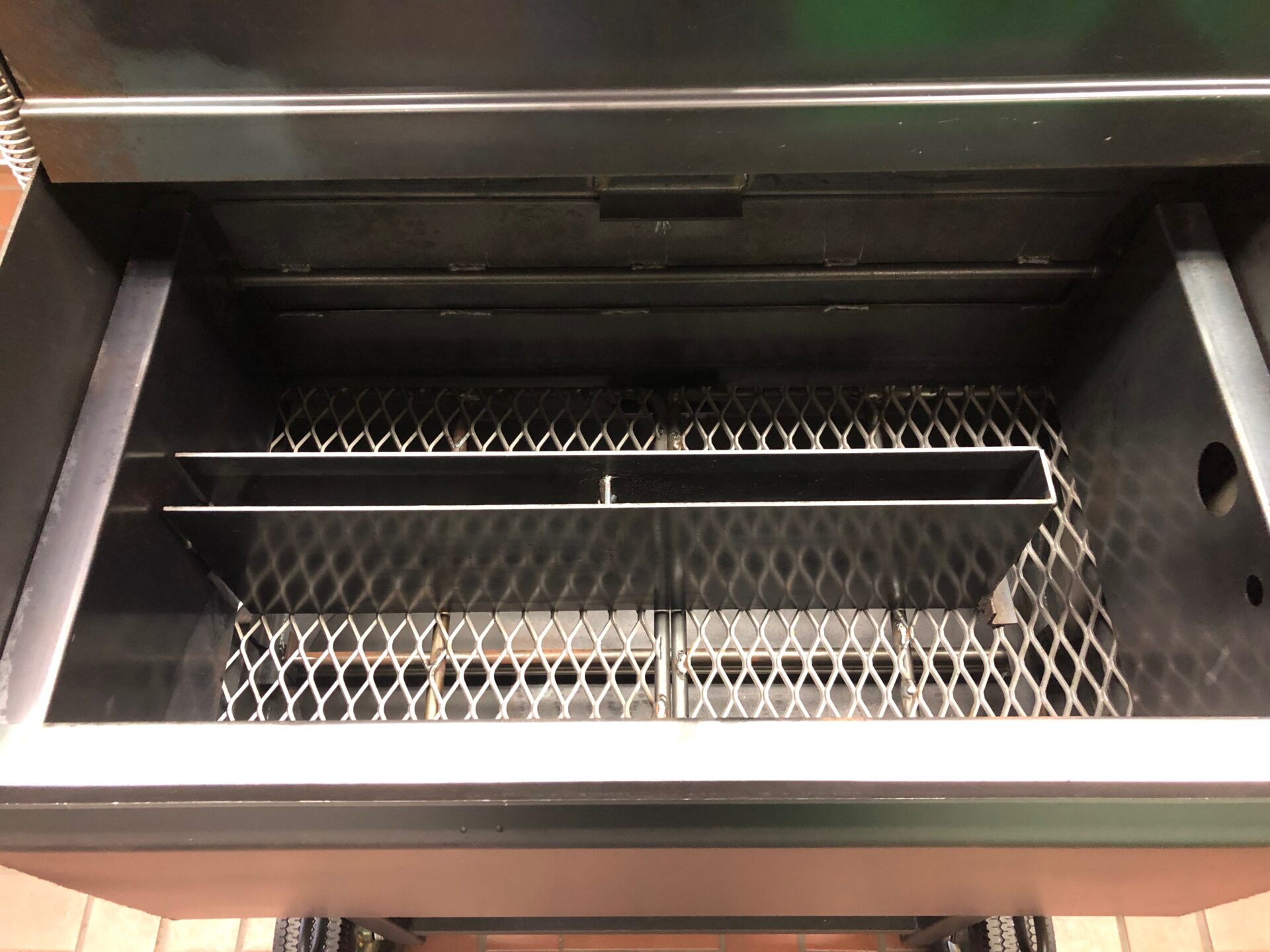 Fire box on the side of the Pit Boss