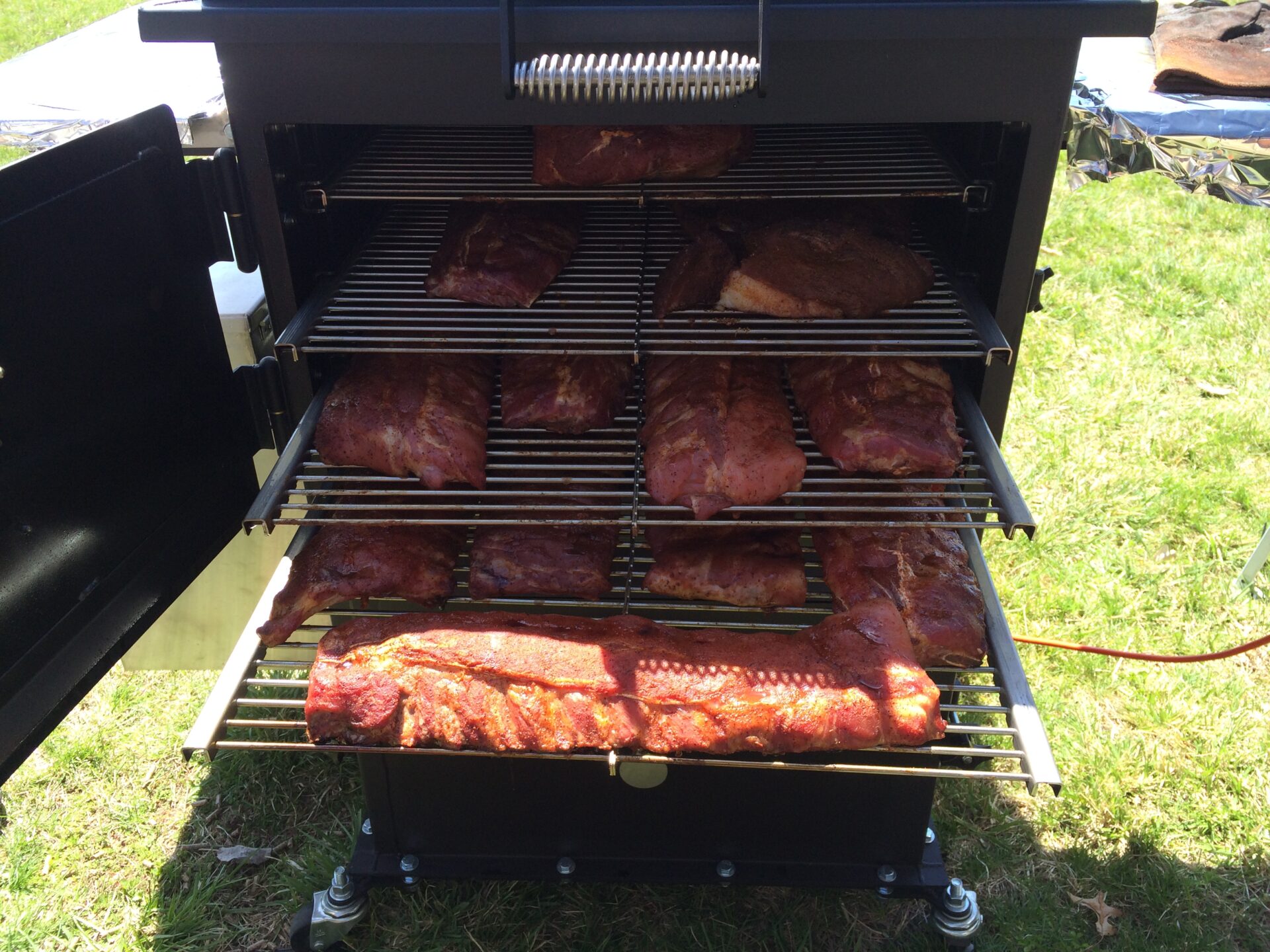 Assortment of meats being smoked on the Bar-Be-Cube
