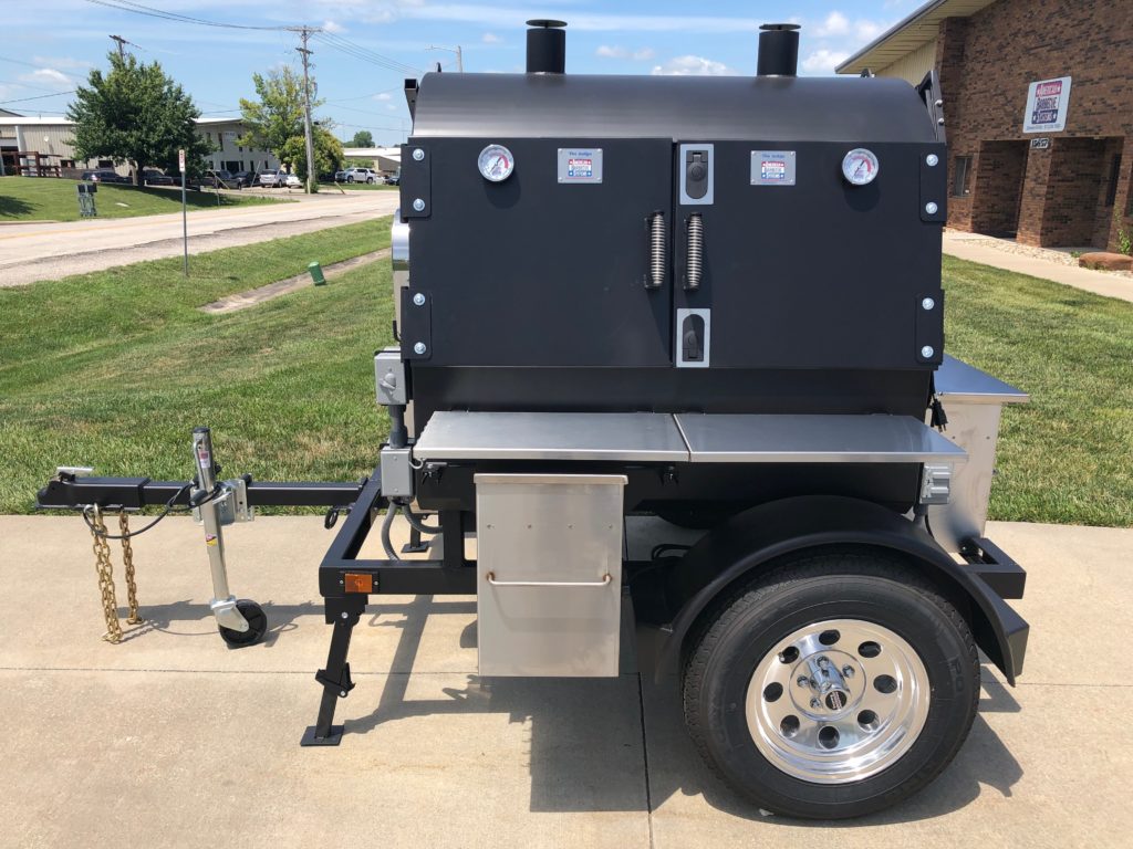 judge with stainless rotisserie smoker and wood pellet system