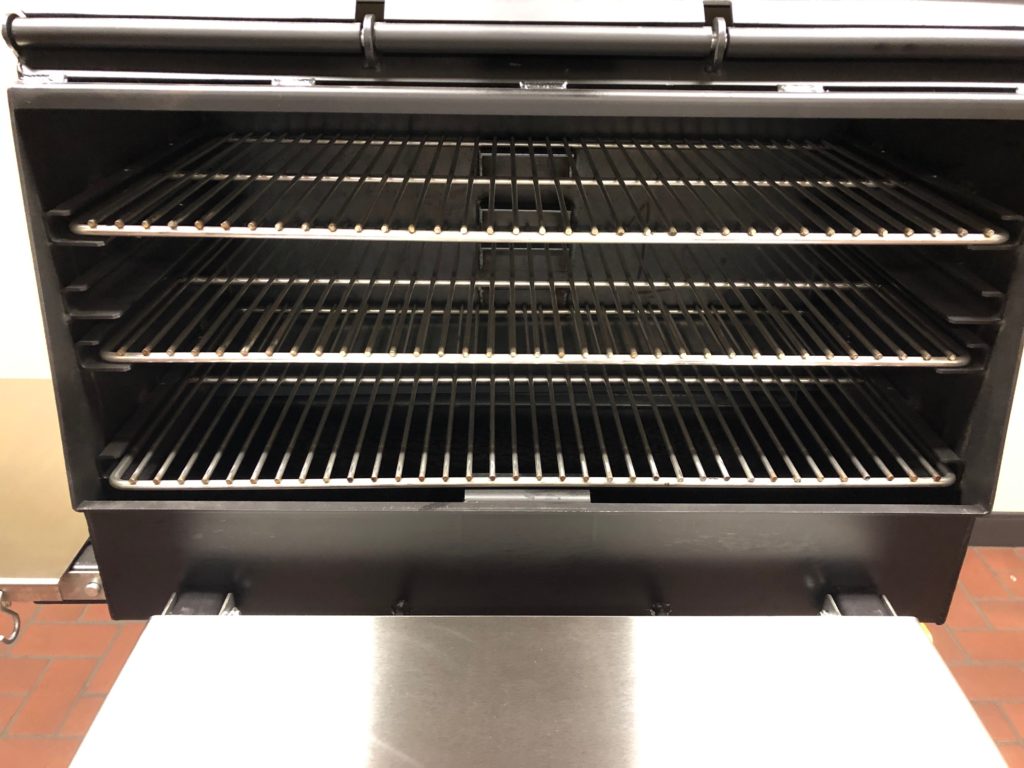 With the doors open, you can see the ample grilling racks inside. 