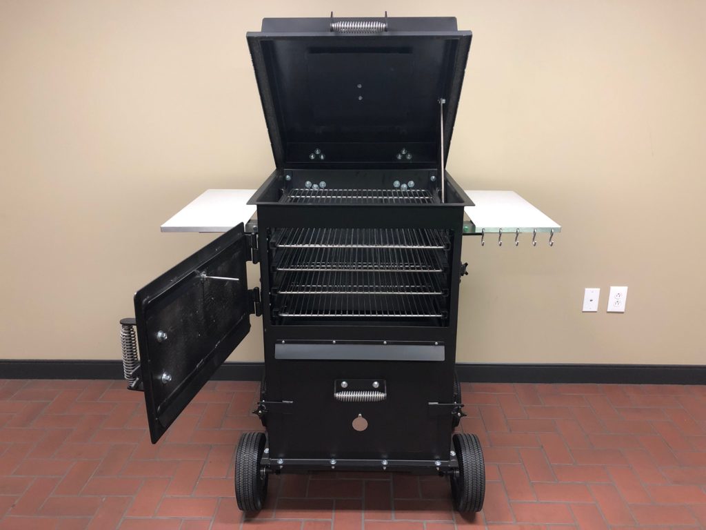The Bar-Be-Cube Smoker/grill boasts a large smokebox door and lid for easy access to stainless steel cooking racks.