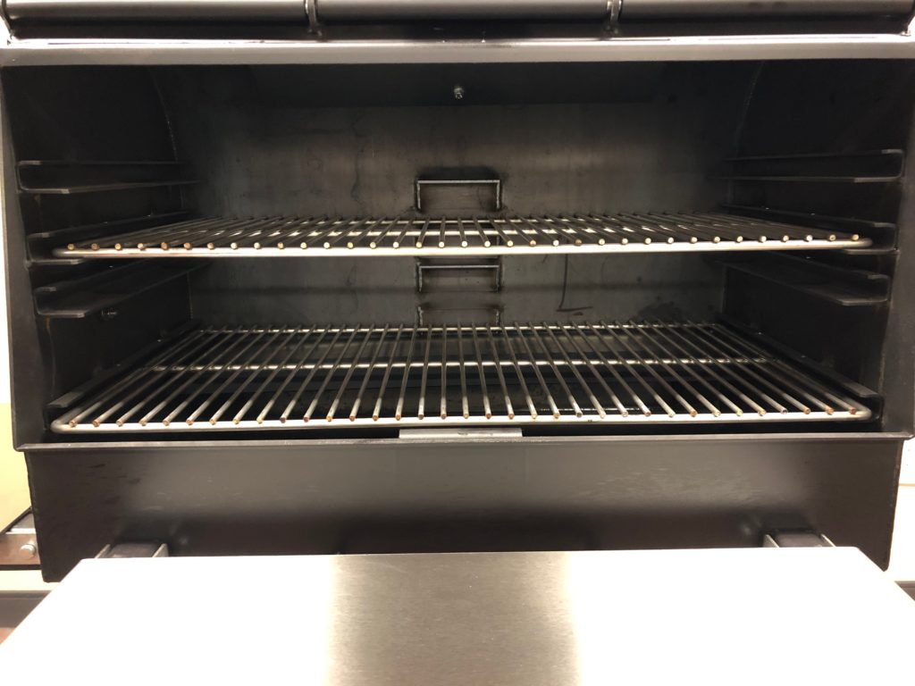 With the doors open, you can see the ample grilling racks inside. 