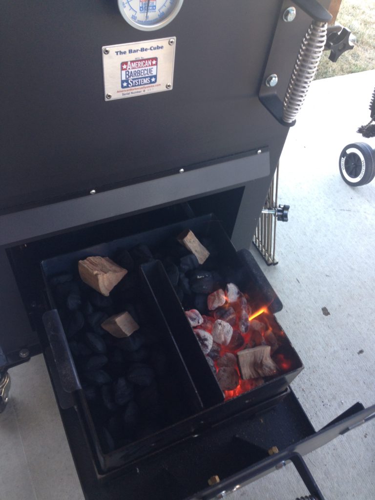 Bar-Be-Cube Smoker/Grill is designed with a charcoal divider for controlled efficient burn.