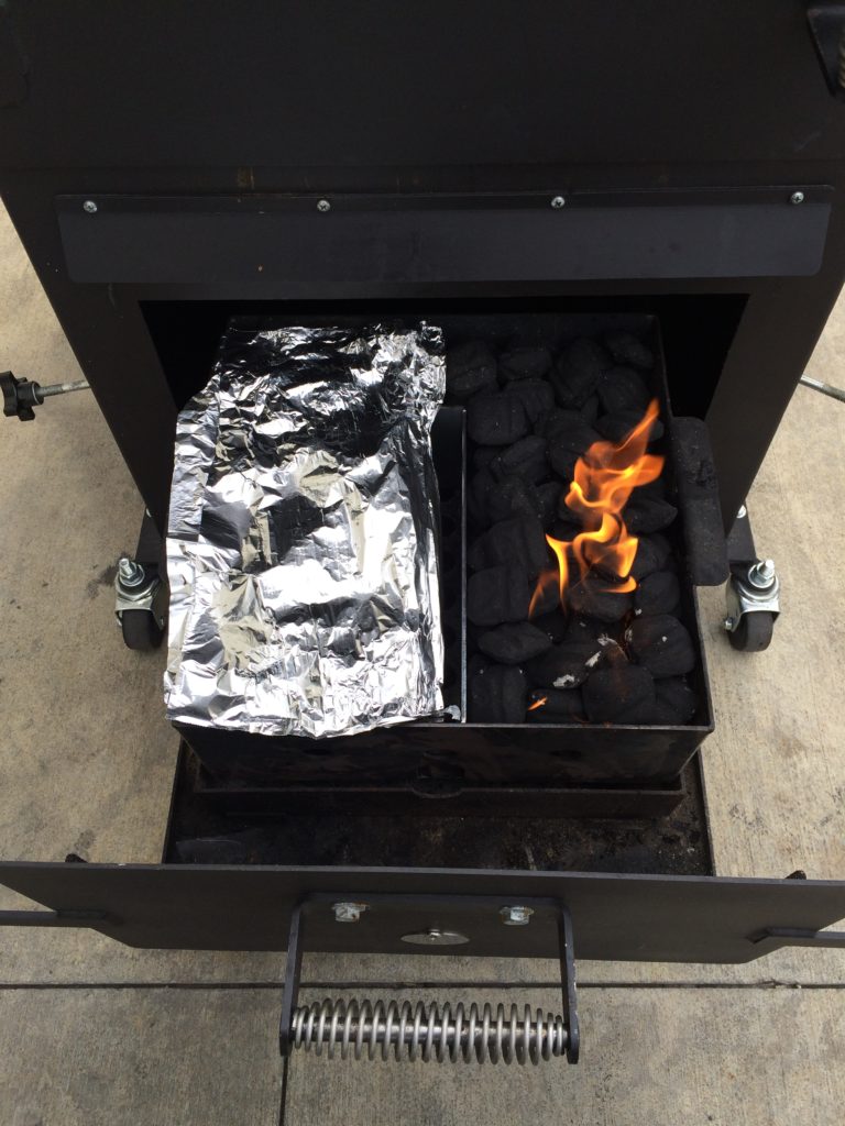 The Bar-Be-Cube Smoker/grill features a divided charcoal basket.