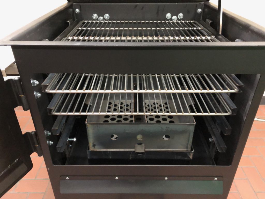 The Bar-Be-Cube firebox is designed with damper plates and a slide-in drawer with a charcoal/wood basket and ash pan which can be repositioned.