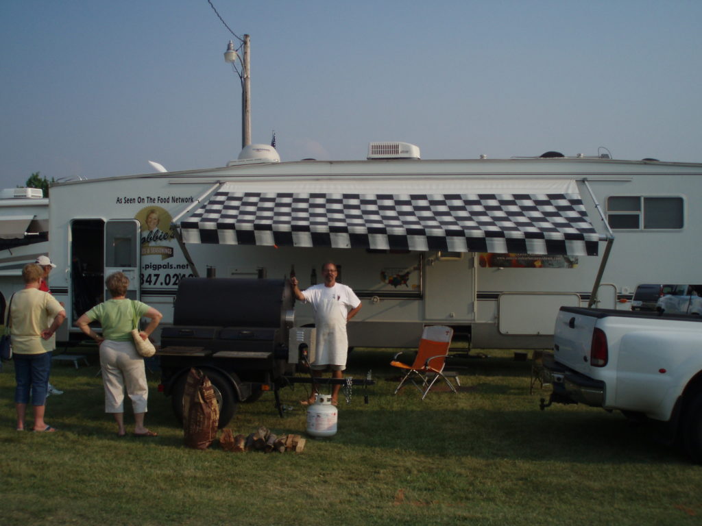 A chef at work using the ABS Judge smoker & grill.