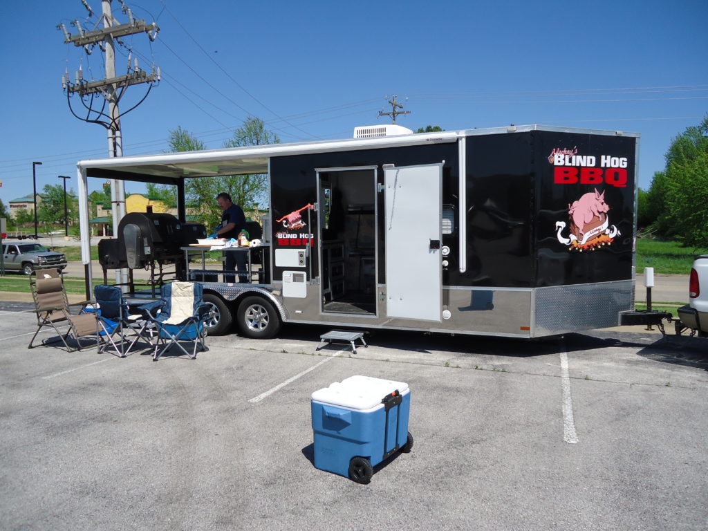 A trailer sporting an ABS smoker & grill at a BBQ competition.