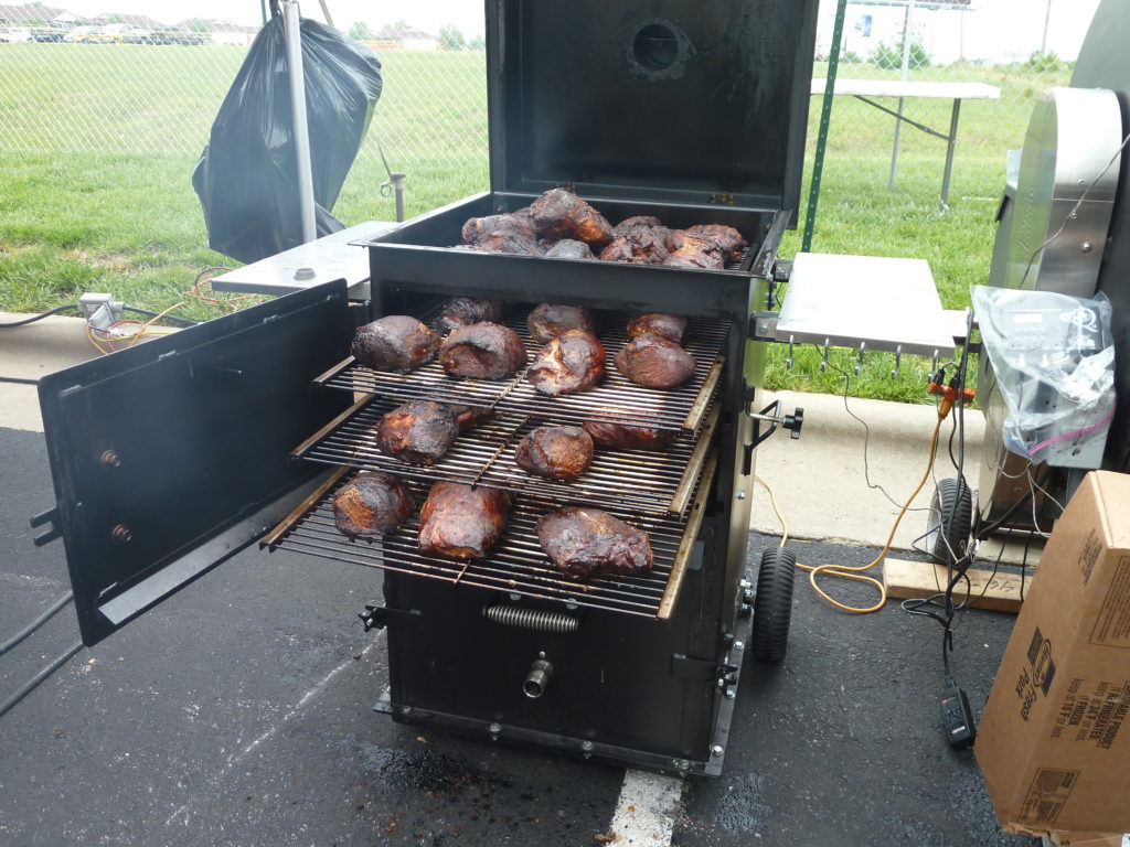 Meats being smoked at one of ABS Events and Competitions.