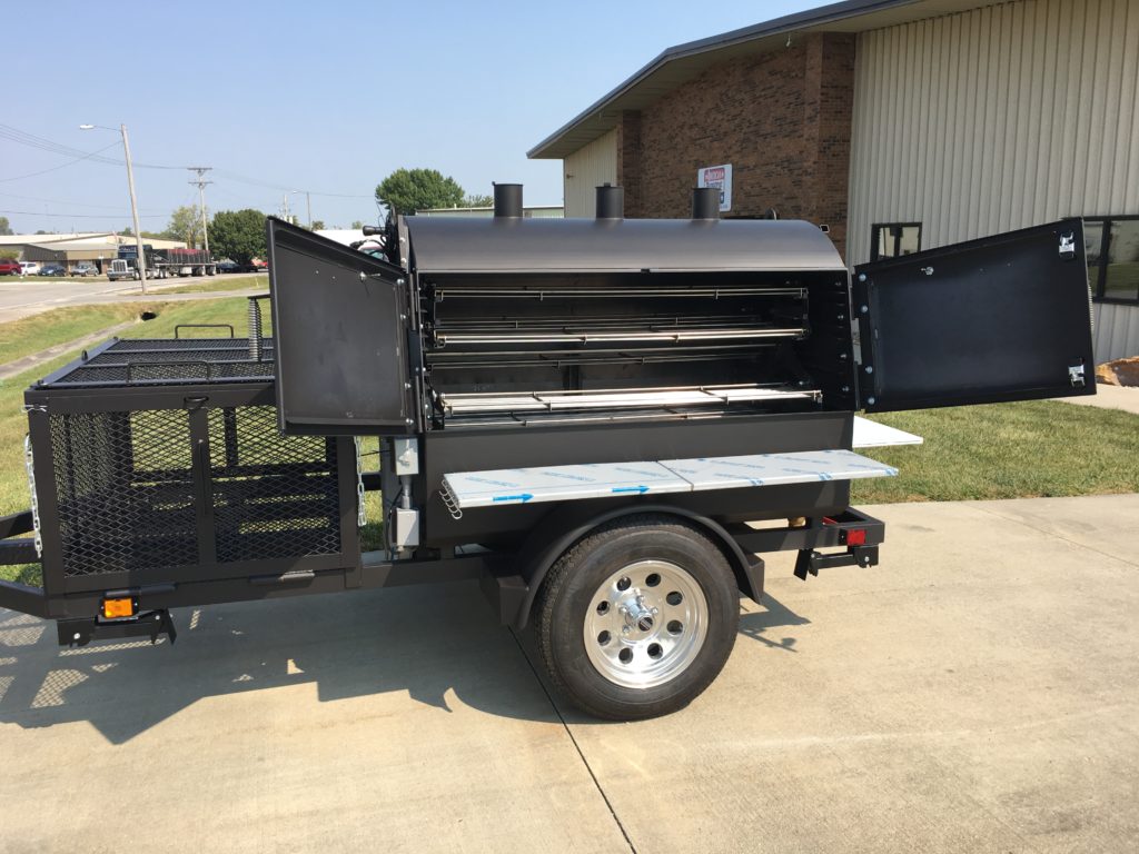 Custom ABS Judge on a trailer, doors are open to show the stainless rotisserie. 