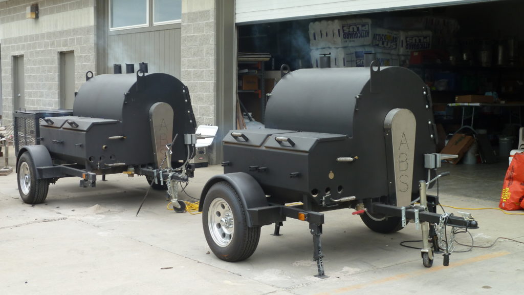 Two ABS smoker/grills side by side. 