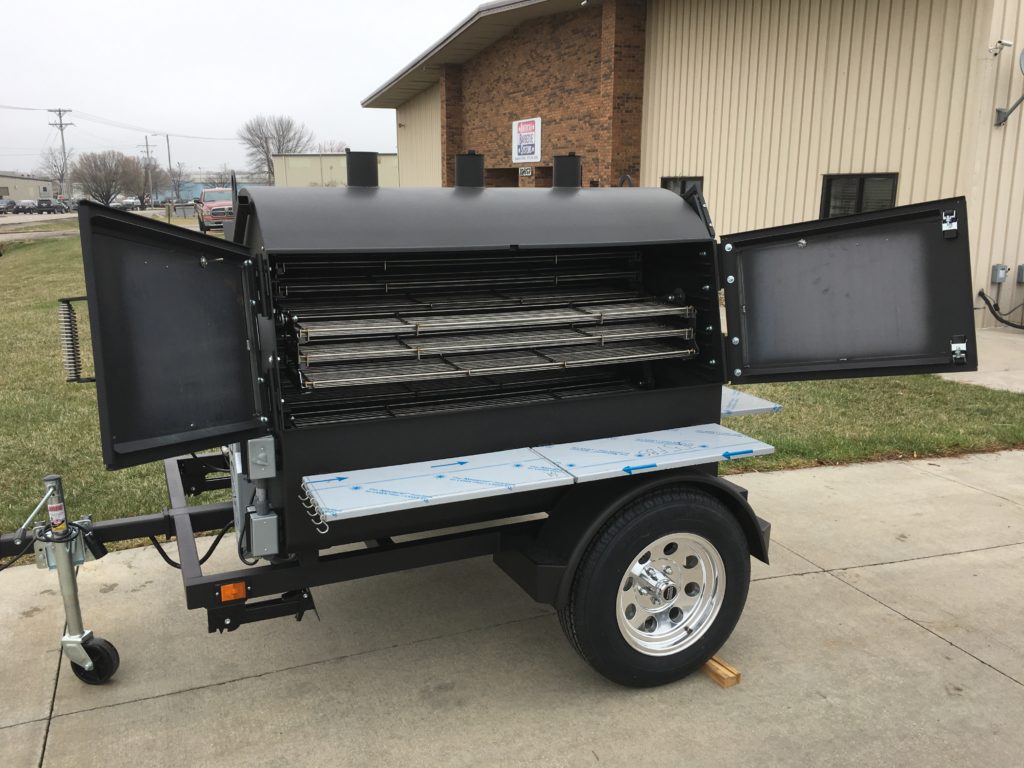 An ABS Judge with the doors open showing its stainless rotisserie. 