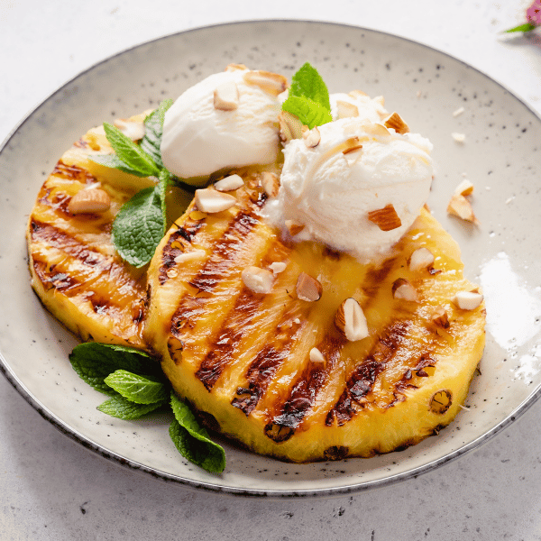 Take dessert to the next level with grilled pineapple with vanilla ice cream.