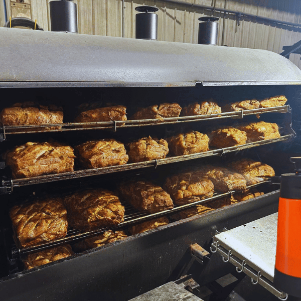 Pork butts on the ABS Judge with dry rub applied.