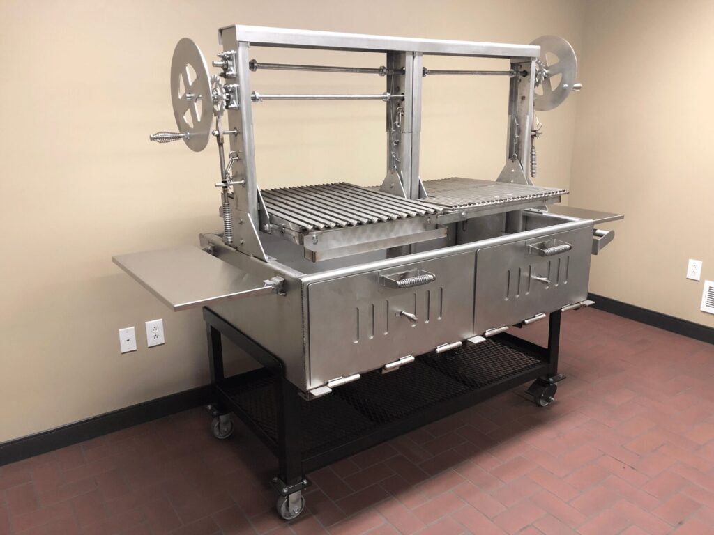 Angled view of the SMG 60 SS Santa Maria Grill with the top grates lifted up.